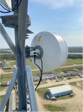 Axsera - antenna mounted on tower in rural area